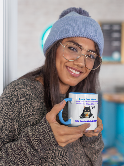 'I am a Cat's Mom, I couldn't get a better resemblance of myself in my child and I love it! Vote Harris-Walz 2024! Accent Coffee Mug (11, 15oz)